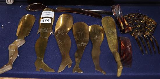 Seven brass stocking leg shoe horns and a group of tortoiseshell hair combs, spoon, page turner, etc.